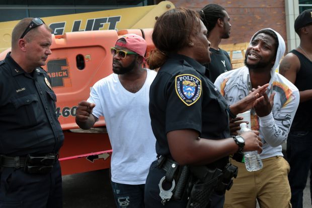 Scores protest police shooting of Michael Brown